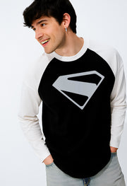 Man wearing FantasyFit Superman Raglan t-shirt with black body and white sleeves featuring a large silver Superman emblem