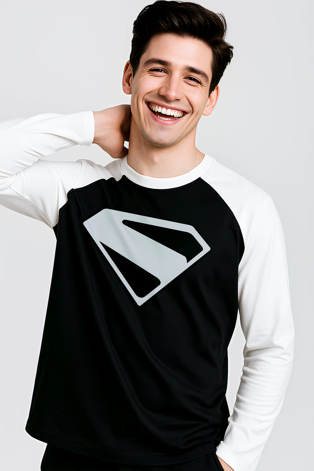 Smiling man wearing black and white Superman Raglan t-shirt with large silver logo on chest