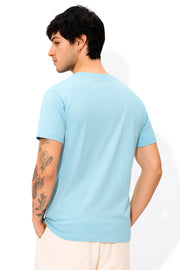 FantasyFit Superman unisex t-shirt light blue back view on male model with arm tattoos