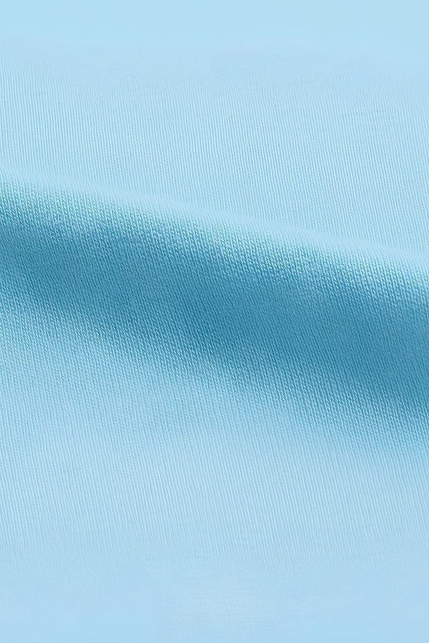 FantasyFit Superman unisex t-shirt light blue fabric close up showing soft cotton knit texture and stretch